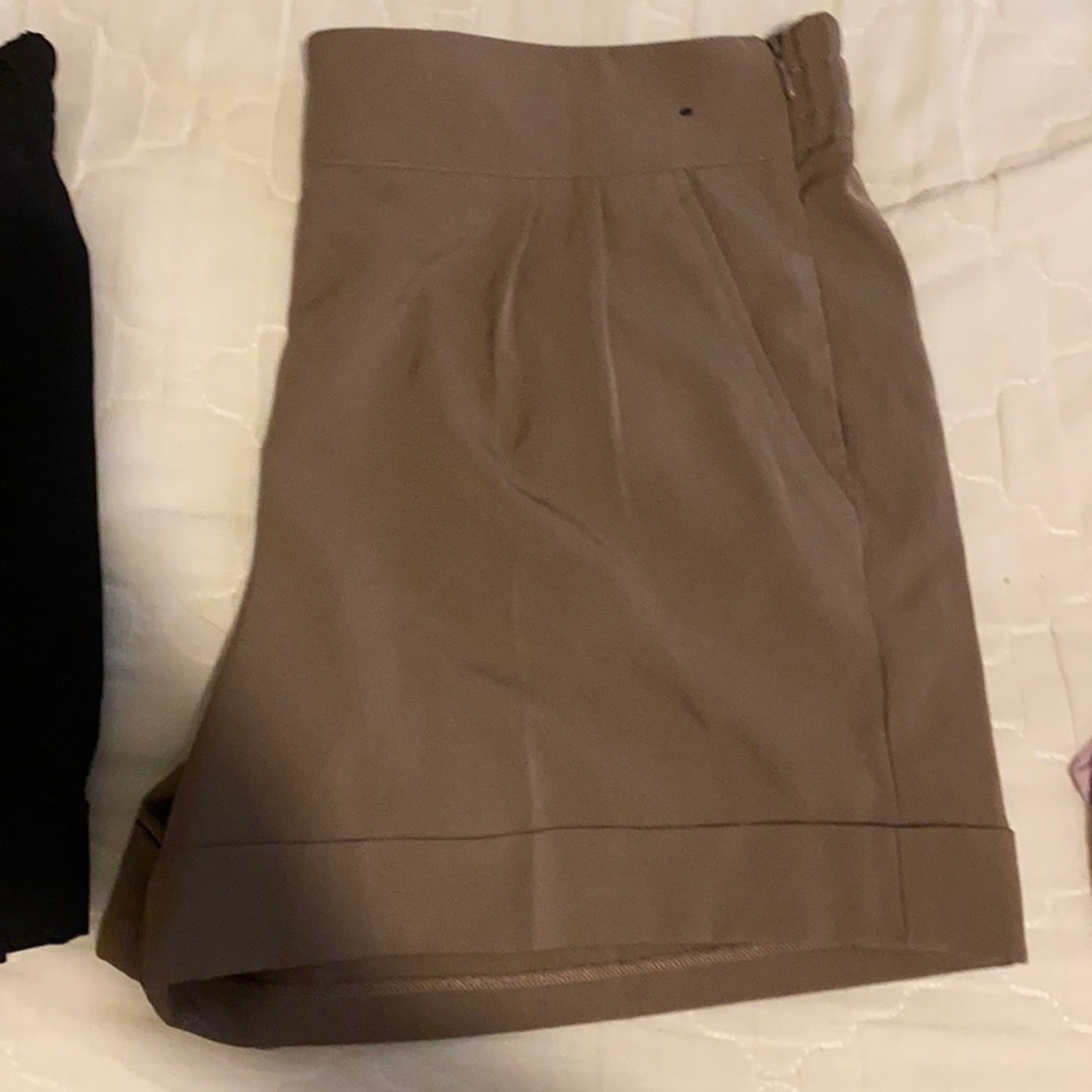 Tan and black shorts